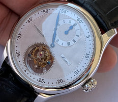 Close-up of ST8006 Tourbillon watch with white textured dial, blue hands, visible tourbillon, and black American alligator leather strap