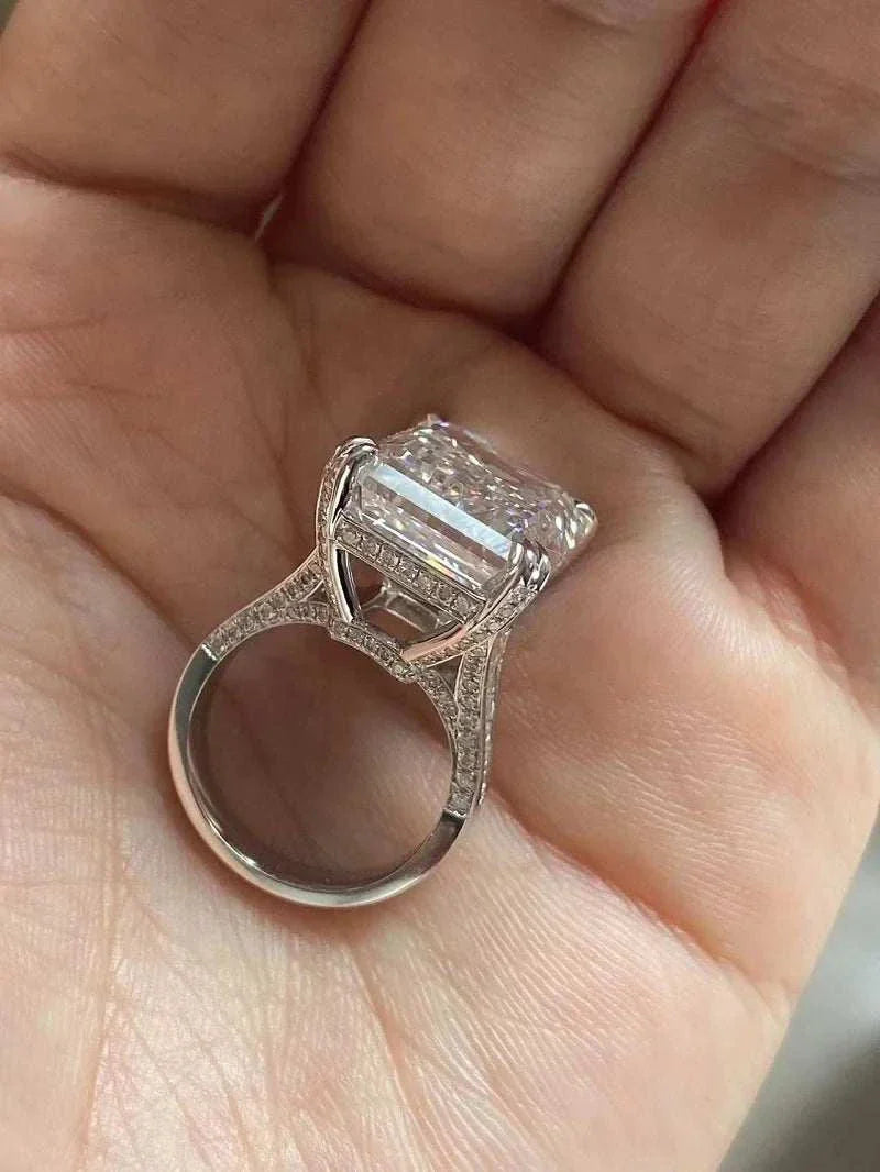 Ruif unique customized 20-carat emerald cut diamond ring with VS1 clarity and F color held in hand
