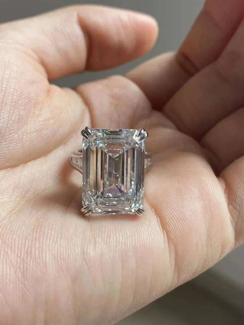 20-carat emerald cut diamond ring with VS1 clarity and F color, held in hand, Ruif Unique Customized The Alchemist's Star-Heart