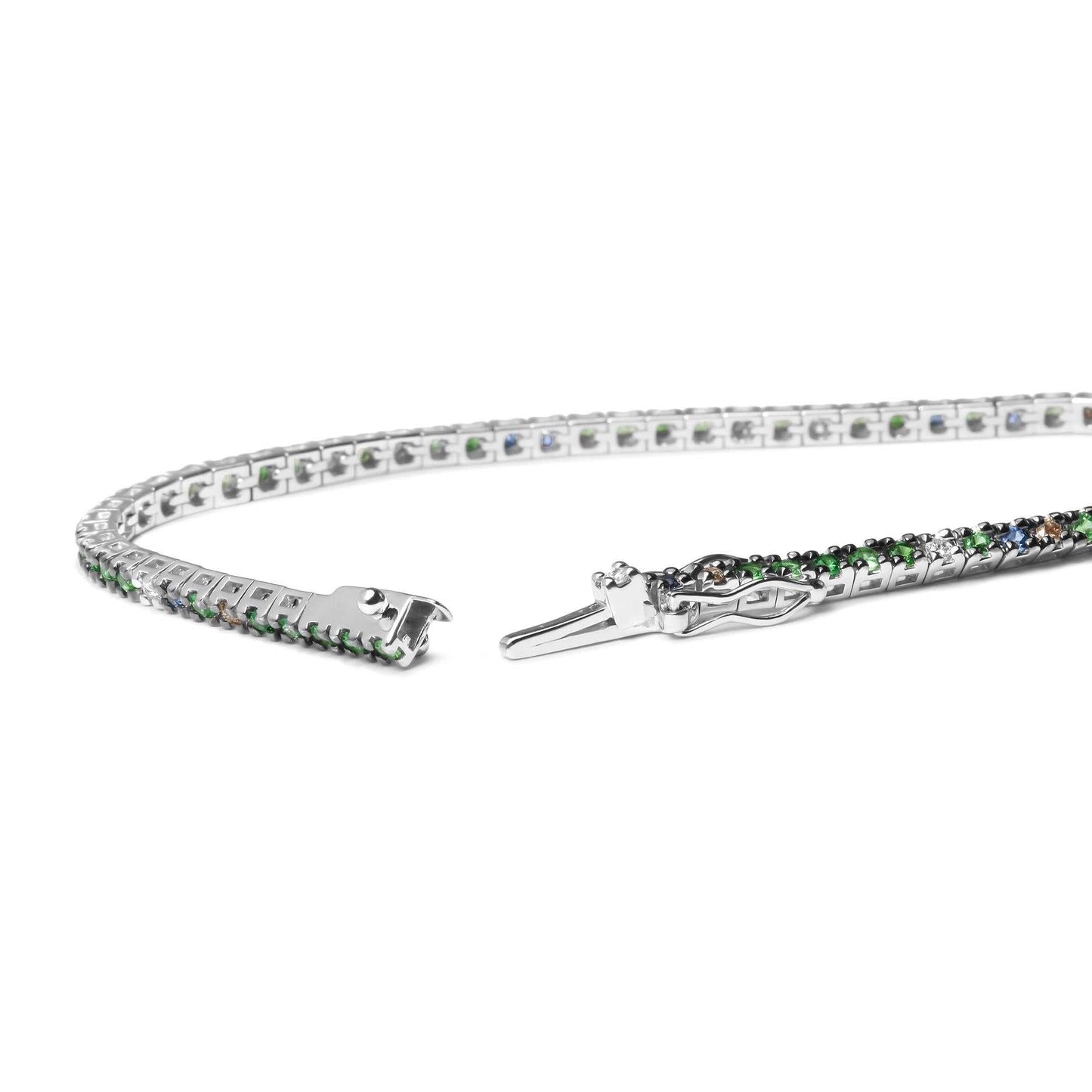 18K white gold tennis bracelet with blue sapphires, green tsavorite gemstones, and 3/8 CTTW diamonds in prong settings