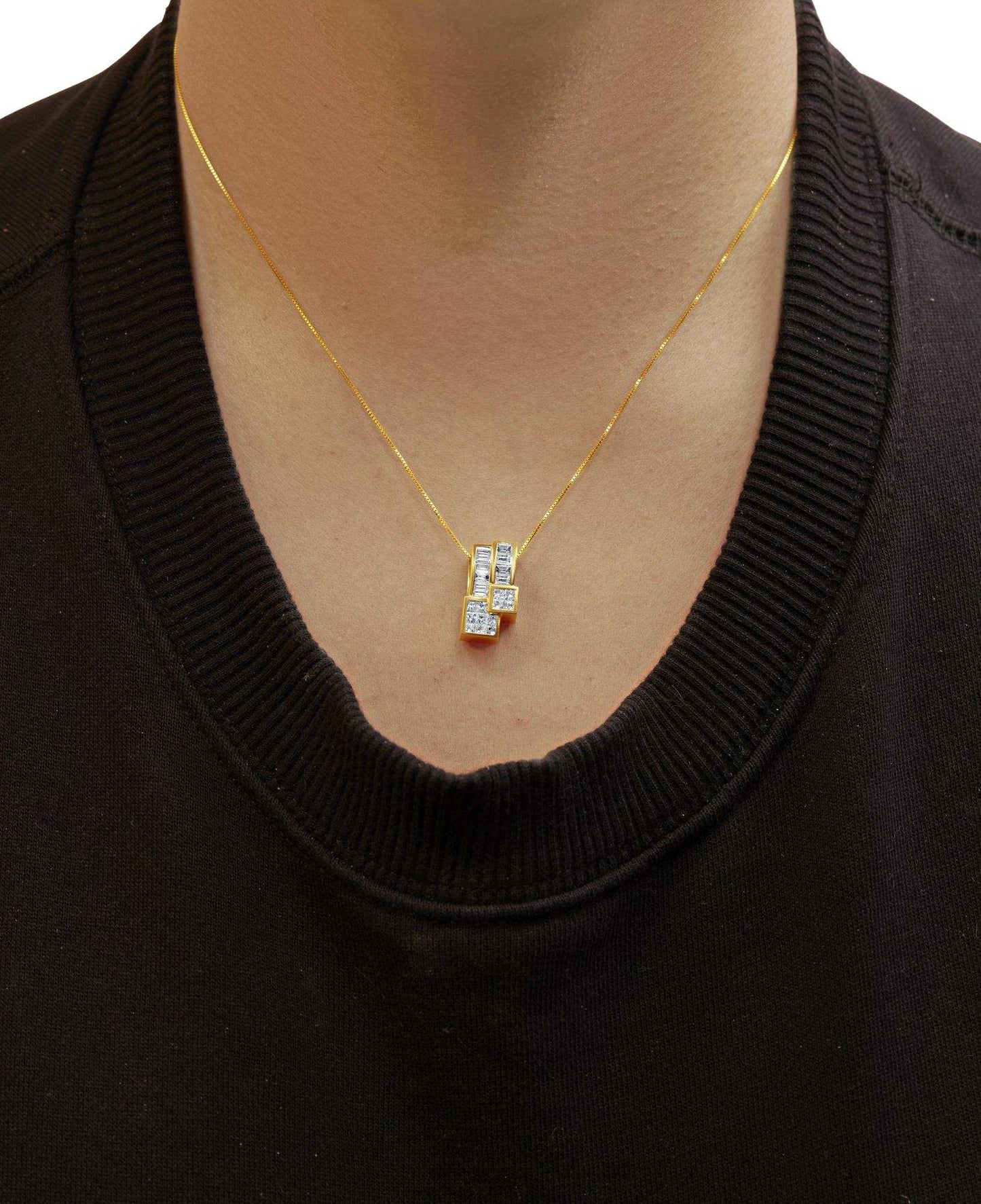 14K yellow gold geometric pendant necklace with baguette and princess-cut diamonds on an 18-inch box chain worn on neck