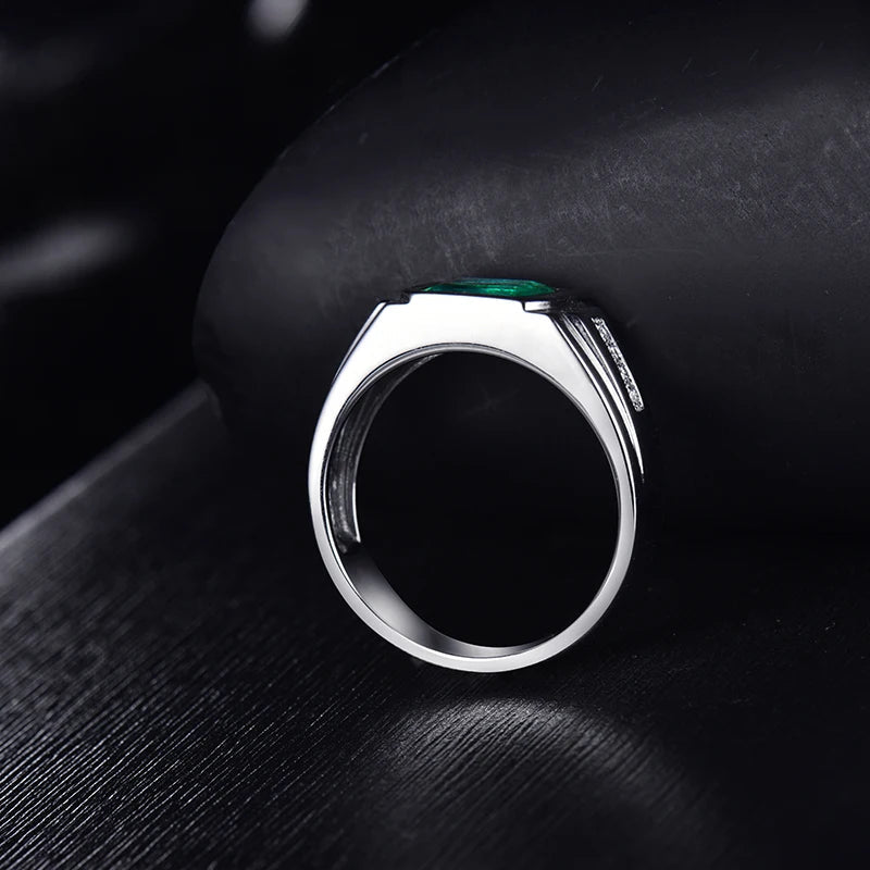 Solid 18k white gold men's ring featuring a natural emerald and round diamonds for engagement or eternity gift