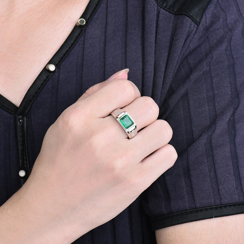 Solid 18k white gold men's ring with natural emerald and diamonds on hand