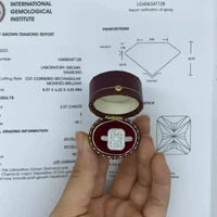 Radiant Ring of Elysian Light 14K white gold 2-carat lab-grown diamond halo ring in a red velvet box with certification document background