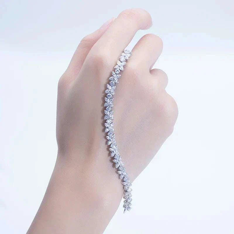 14k gold and diamond Cuban bracelet named Frostforged Chain of the Titan displayed on a hand