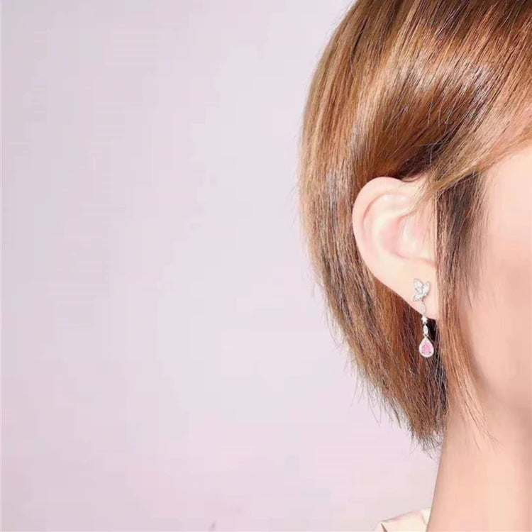 Lovely Design Diamond Earring featuring 0.34ct natural pink diamond drop in white gold setting worn on ear