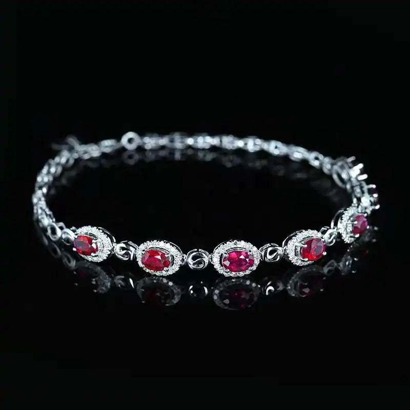 SGARIT 18K white gold vintage bracelet with 2.45CT red ruby and diamond accents on black background