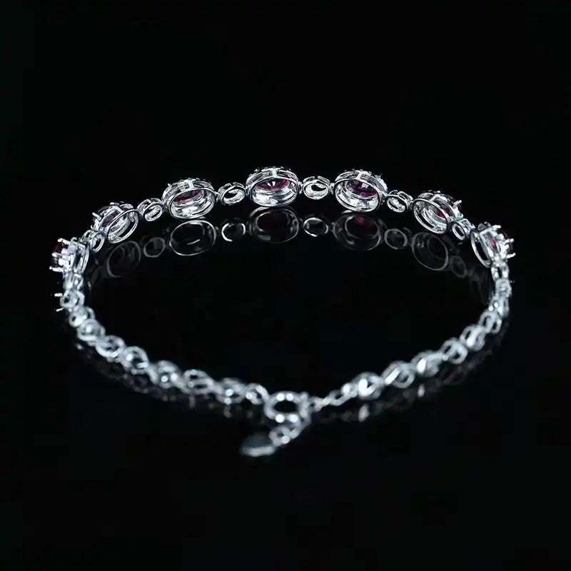 SGARIT 18K white gold vintage bracelet with 2.45CT ruby and diamond accents on black background