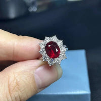 Eryndor's Crimson Starfire Ring featuring a 3-carat natural Mozambique ruby surrounded by sparkling diamonds set in 18K white gold.