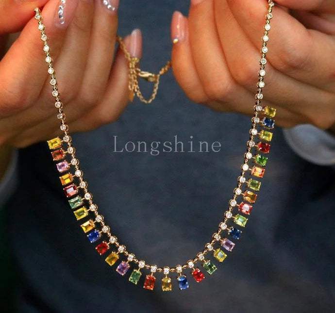 18K gold yellow color chain necklace with multicolored rectangular gemstones held by hands