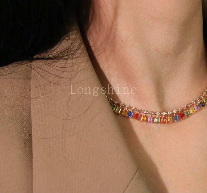 18K gold yellow color chain necklace with multicolored gemstones worn on neck