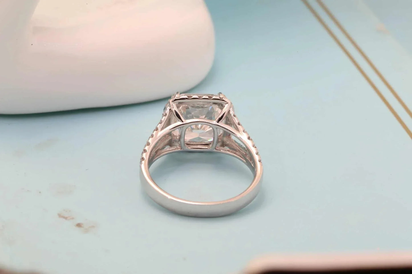 Close-up of the Starfire Crown of Avaloria ring featuring a 5.0ct cushion-cut diamond in a solitaire setting