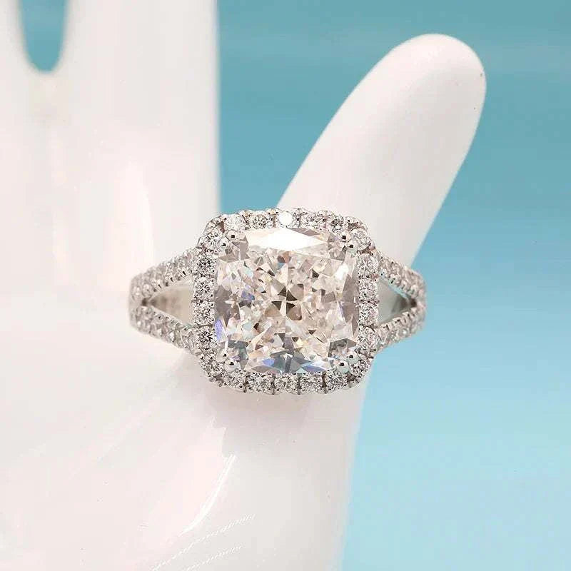 5.0ct cushion-cut diamond solitaire ring with halo setting, named Starfire Crown of Avaloria, showcasing brilliance and elegance