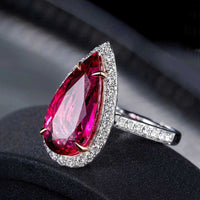 Pear shape rubilite gemstone ring with 18k gold band and diamond accents, elegant wedding jewelry for women