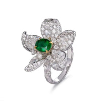 Luxury recycled 18ct gold flower-shaped ring with natural emerald and diamond accents