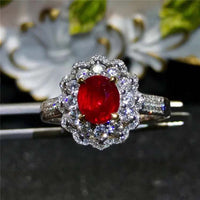 SGARIT AU 750 18kt gold engagement ring with 1.53 carat red ruby and diamond accents