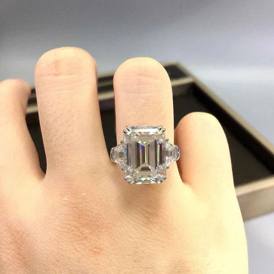 Celestial Flame of the Archmage ring featuring a 10ct moissanite center stone in 18K gold setting on hand