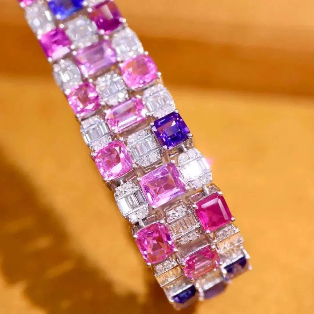 Close-up of The Rosefire Legacy bracelet featuring 18K gold with pink sapphires and diamonds