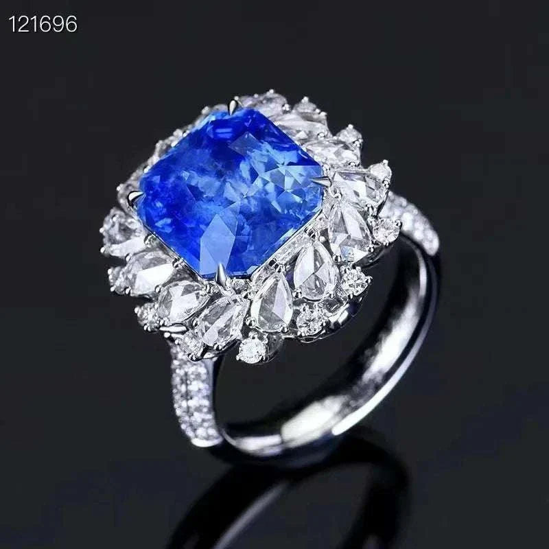 18K gold set ring with 8.24 carat natural Sri Lanka royal sapphire and large diamond halo
