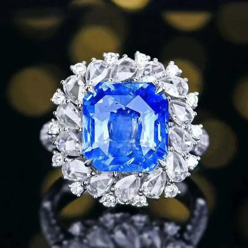 18K gold set ring with large diamonds and 8.24 carat natural royal blue sapphire from Sri Lanka