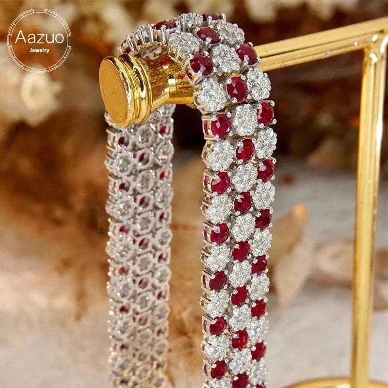 18K white gold tennis bracelet with natural rubies and diamonds in intricate cluster design