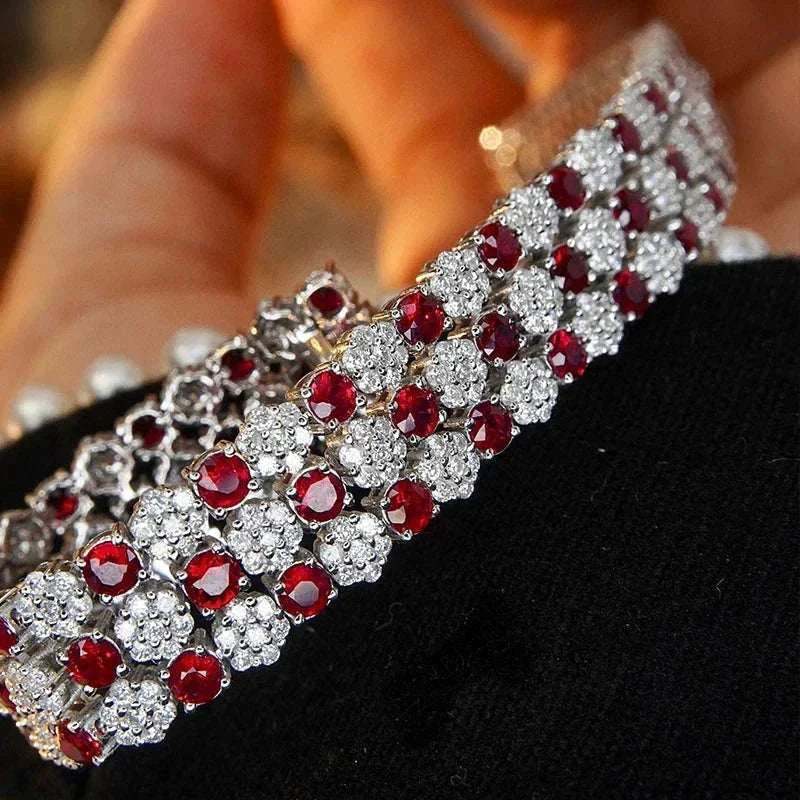 18K white gold tennis bracelet with natural rubies and diamonds in an intricate design