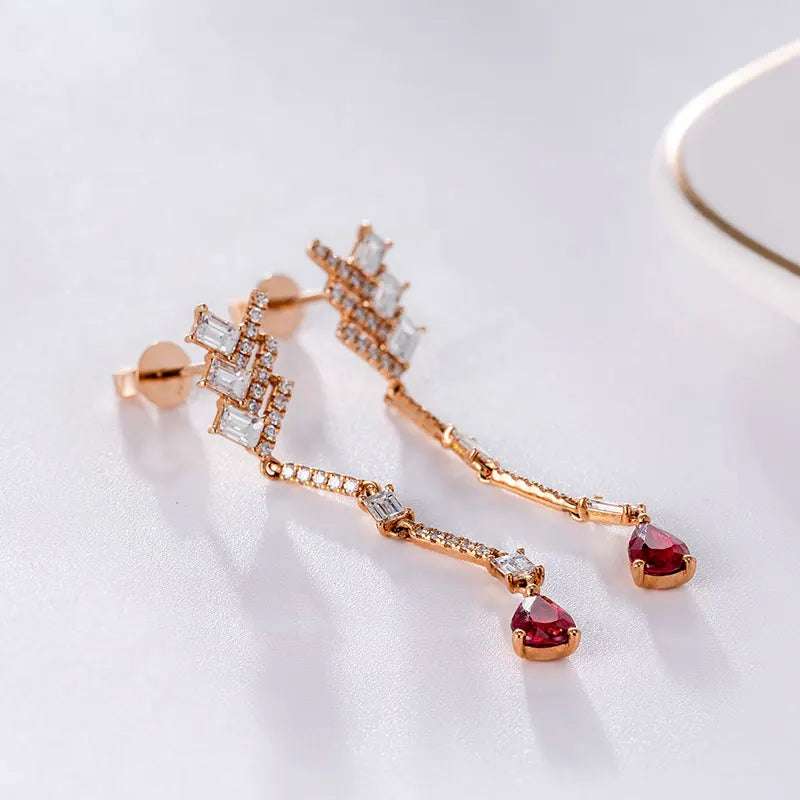 18K white gold dangle earrings with diamonds, white topaz, and pear-shaped black onyx gemstones