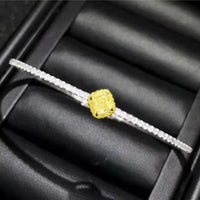18K gold luxury bangle with 0.364ct natural yellow diamond and diamond accents in elegant design