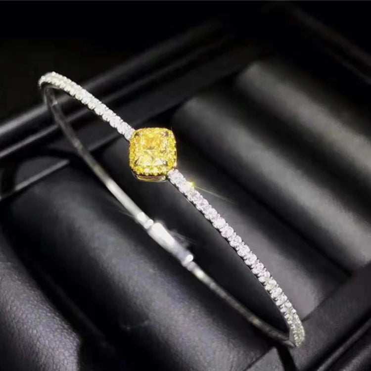 18K gold bangle with 0.364ct natural yellow diamond and diamond accents in elegant design