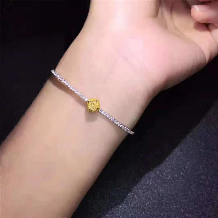 18K gold bangle with 0.364ct natural yellow diamond on wrist