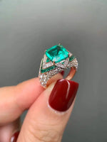 Green Lantern ring featuring a 3.44-carat lab-grown emerald and diamond accents set in 18K gold