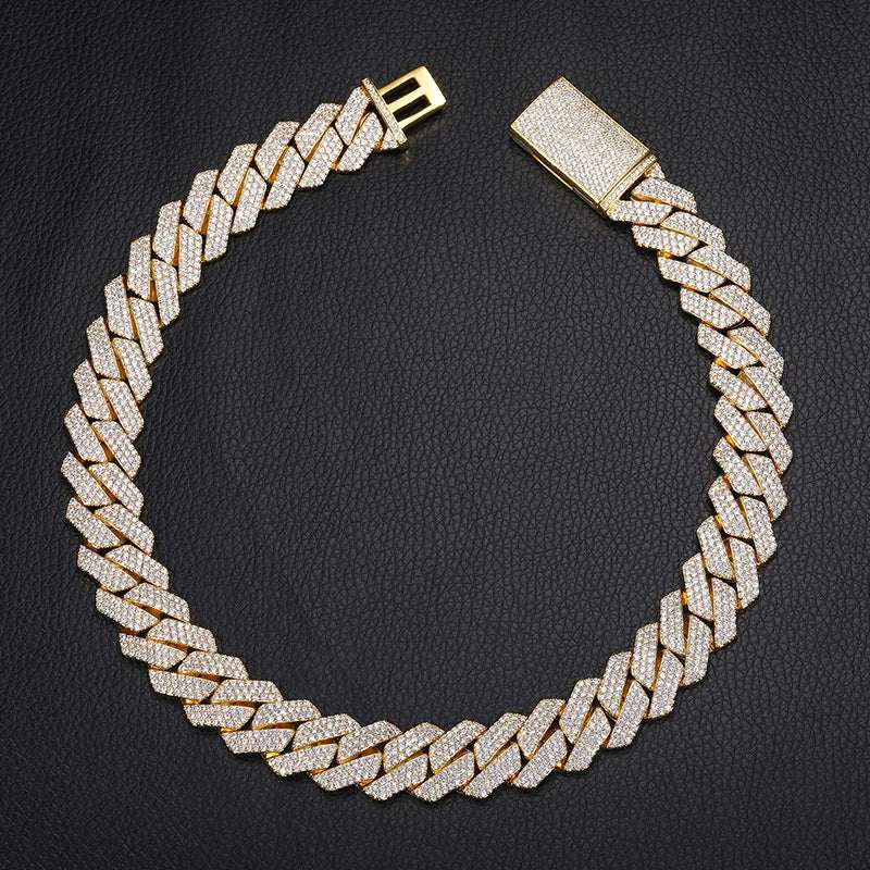 925 Sterling Silver VVS Moissanite Cuban Link Chain Iced Necklace in gold tone with brilliant stones on black background