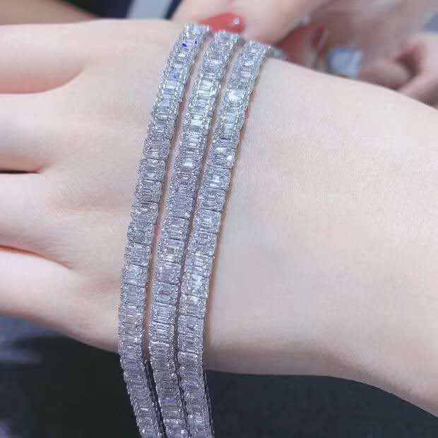 Natural diamond iced out tennis bracelet with multiple rows of sparkling diamonds on a wrist