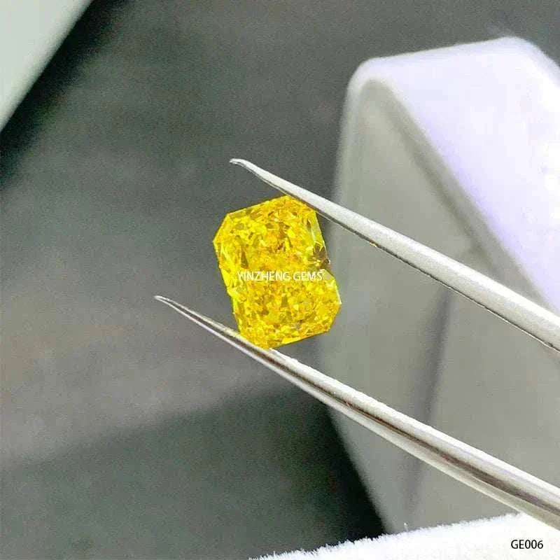 3.55 carat fancy vivid yellow Aurelion Shard lab-grown diamond held by tweezers against a neutral background