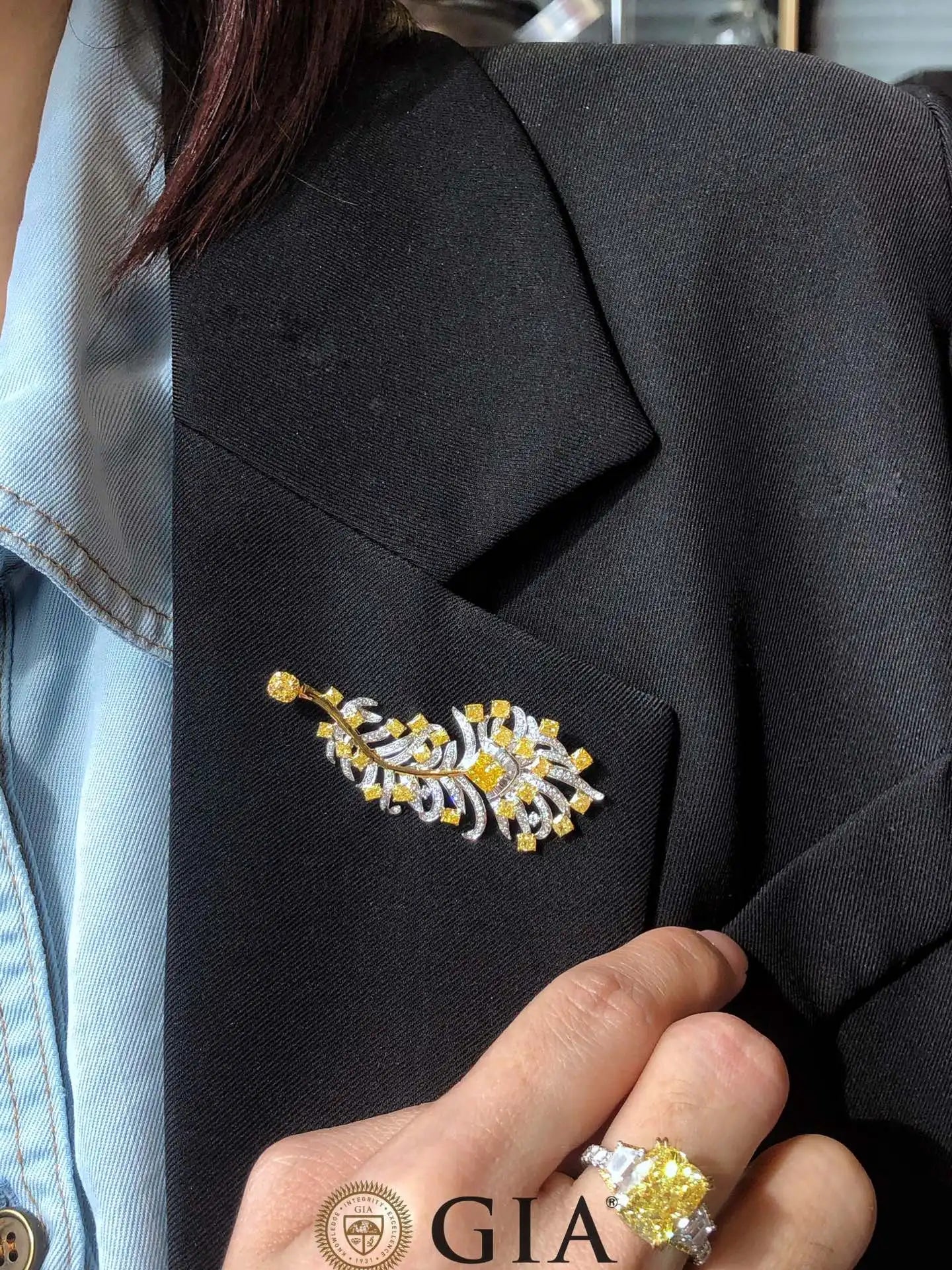 Sun-Enchanted Elven Brooch in 18K white gold with 0.73 ct natural yellow diamonds, elegant leaf design pinned on black blazer lapel.