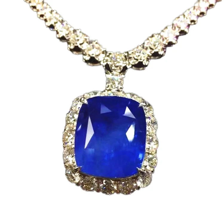 SGARIT Rare Collection 41.33ct Burma cornflower blue sapphire pendant in 18k white gold with diamond halo.