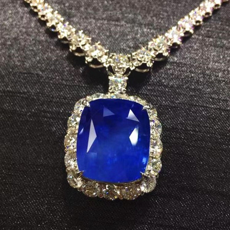 41.33ct Burma cornflower blue sapphire pendant in 18k white gold from SGARIT Rare Collection with diamond halo and necklace chain