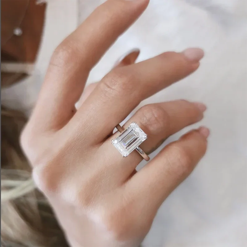 Eternity Prism 5ct emerald-cut diamond ring on hand with silver band
