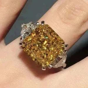 The Laurelin Sunstone 10 carat yellow moissanite ring with diamond accents in 14K white gold, inspired by myth and legend