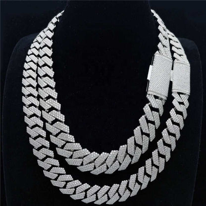 Double-layered Cuban link chain in S925 silver with VVS moissanite diamond accents on a black display bust