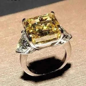 The Laurelin Sunstone 10 carat yellow moissanite ring with diamond accents in 14K white gold