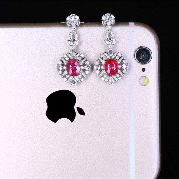 Elegant drop earrings featuring deep red unheated rubies set in intricate 18k gold with diamond accents, The Tears of the Firebird collection.