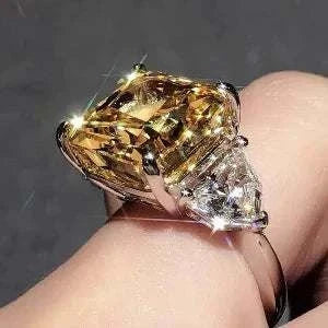 The Laurelin Sunstone 10 carat yellow moissanite ring with diamond accents in 14K white gold