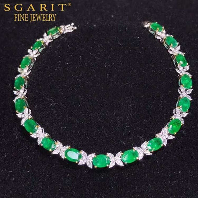 Galadriel's Verdant Vow 5.4ct natural emerald and diamond 18k gold chain bracelet on black background