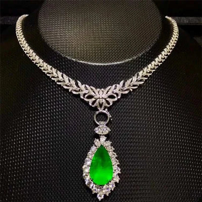 18K gold necklace with pear-shaped 12.78ct green emerald pendant surrounded by diamonds, Heart of the Enchanted Forest design