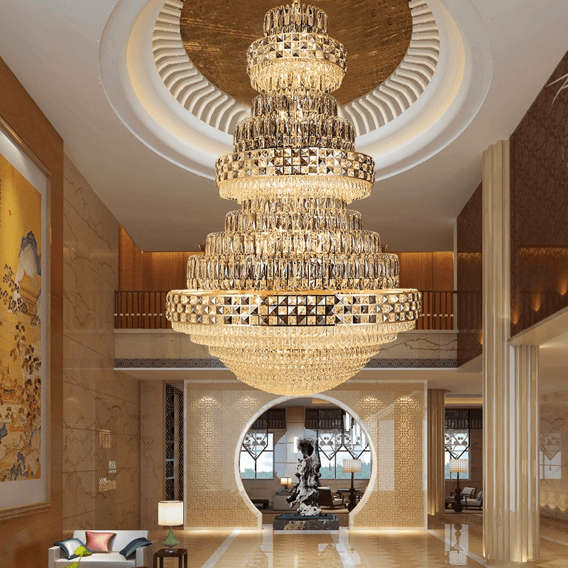 Grand enchanting crystal chandelier Celestial Crown of Eärendil™ glowing luxuriously in elegant high-ceiling room