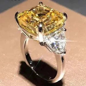 The Laurelin Sunstone 10 carat yellow moissanite ring with diamond accents set in 14K white gold.