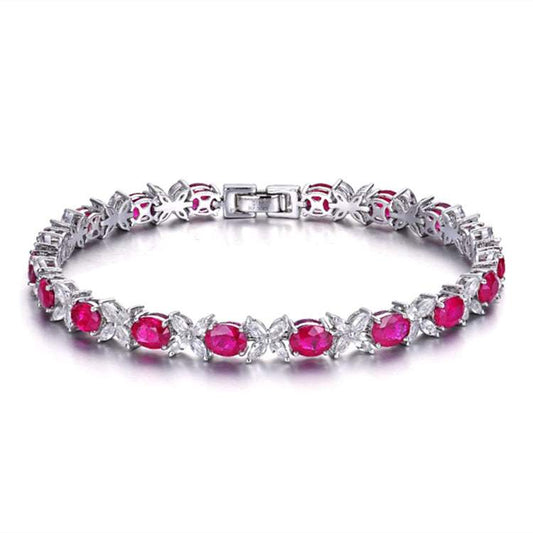 Dragon’s Heart of Eldoria bridal bracelet featuring 18k gold and vivid Myanmar rubies