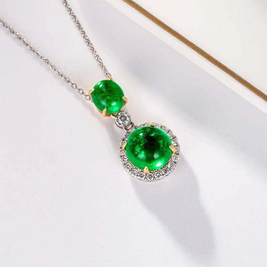 The Verdant Tear of Galadriel 18K gold necklace with vibrant natural emerald pendant surrounded by small diamonds