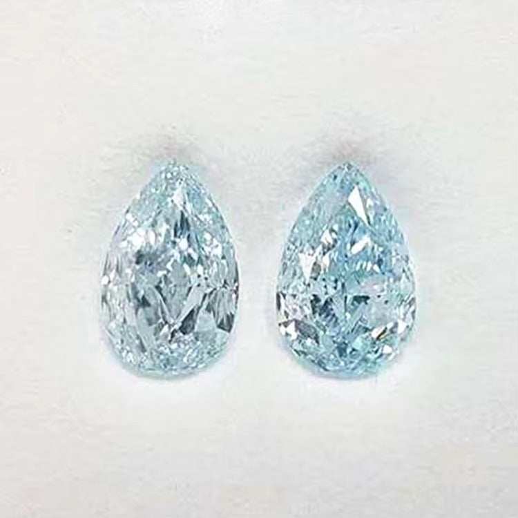 Pair of pear-shaped fancy greenish-blue diamonds totaling 7.39 ct, GIA certified VVS2, known as Naiad’s Tears.